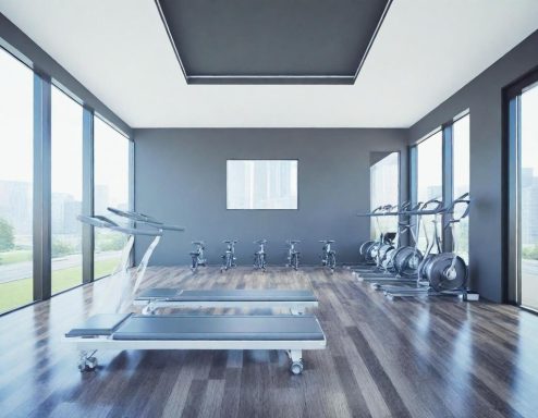 Sport und Gesundheit Moderne Fitnessstudio-Umgebung mit Laufband und Fahrrädern in hellen, geräumigen Räumen.