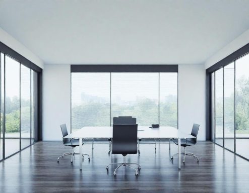 Büro / öffentliche Einrichtungen Moderne Besprechungsraum mit gläsernen Wänden und einem großen Tisch in der Mitte.